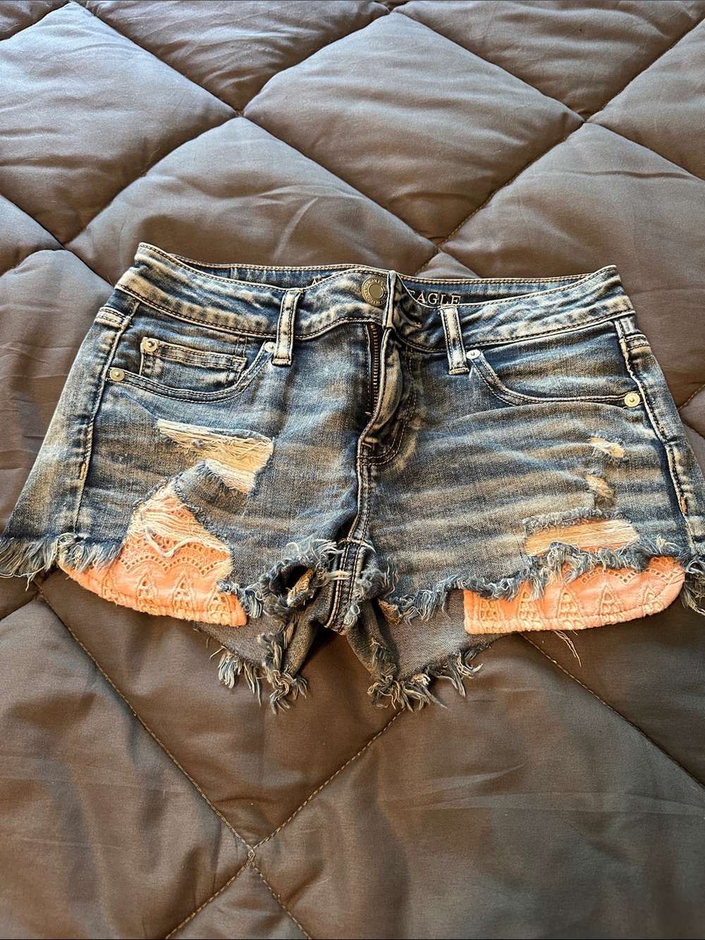 American Eagle Outfitters Distressed Denim Shorts with Pink Lace Insets